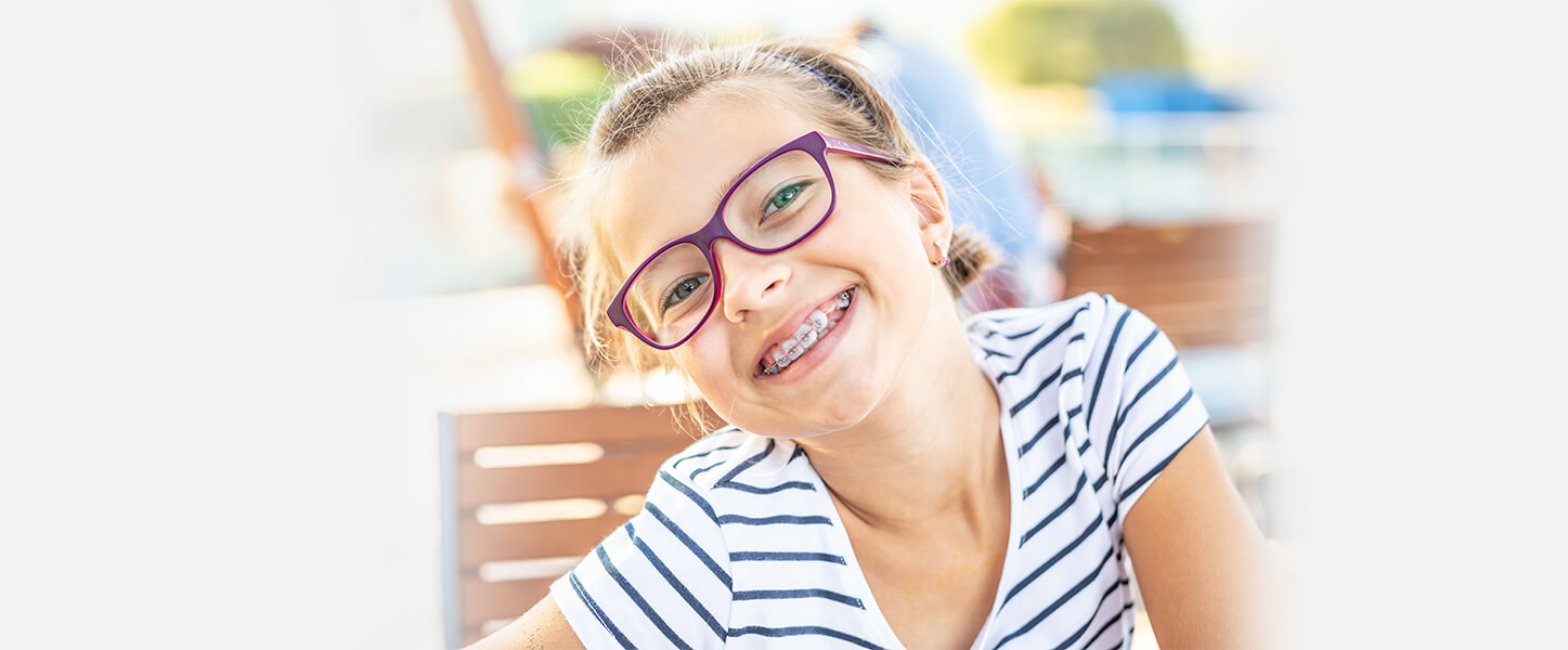 Girl with a orthodontics treatment at Manchester dental office
