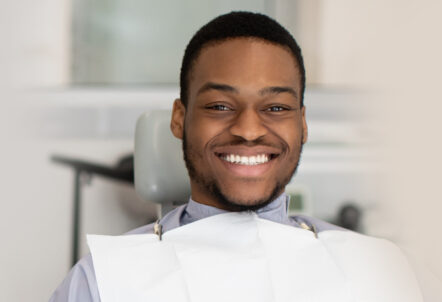 Happy boy during a dental treatment in Manchester